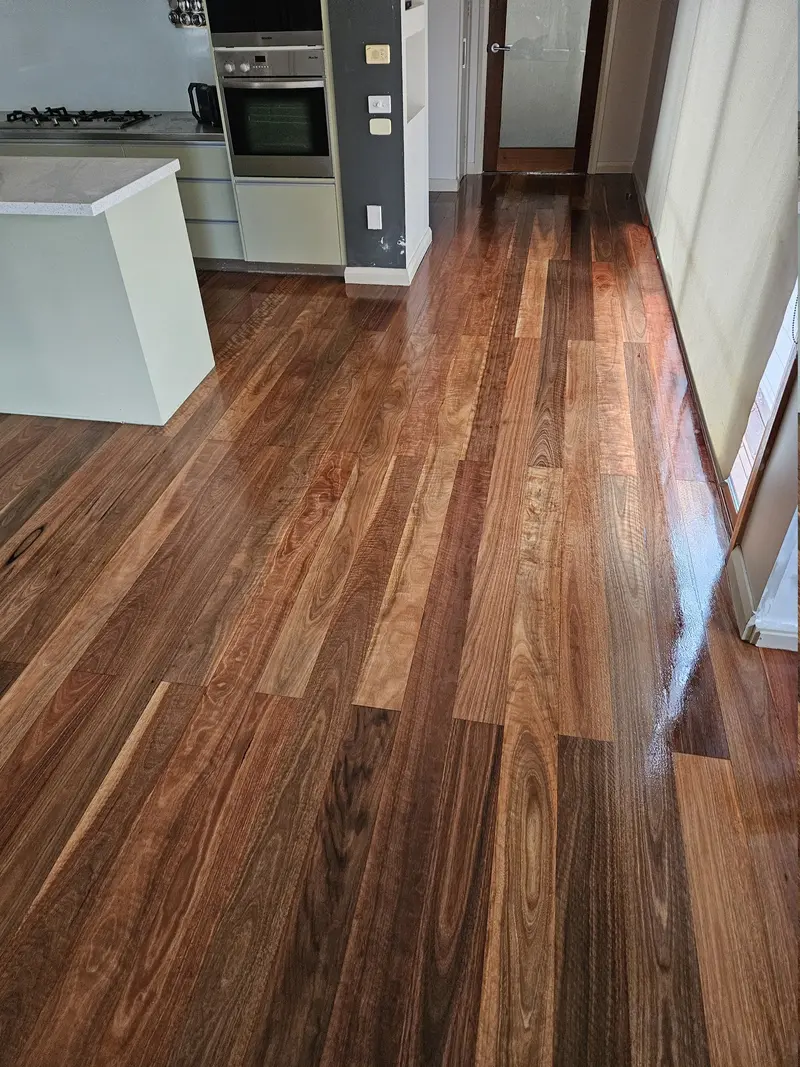 After: the same boards sanded and refinished to an even gloss