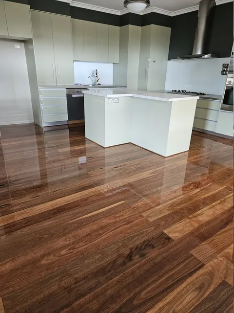 High-gloss hardwood floor around a kitchen island